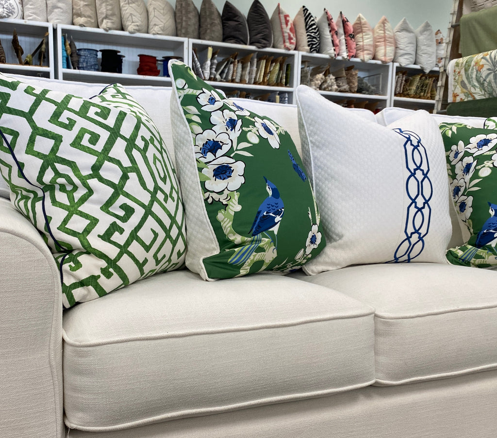 Fabric Showcase Couch with green Pillows in store